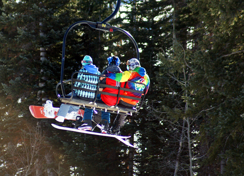 Snowboarders Riding One of the Many Lifts at Brian Head Resort
